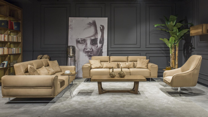 Beige three-seater sofa with cushions