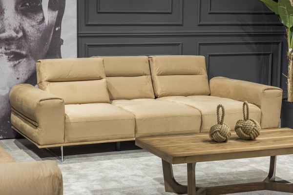 Beige three-seater sofa with cushions
