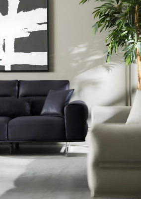 Black, soft and luxurious sofa for three people