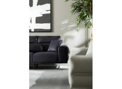 Black, soft and luxurious sofa for three people
