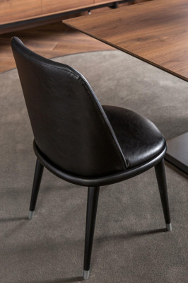 Luxurious black leather armchair, upholstered chairs, designed furniture for the living room and kitchen