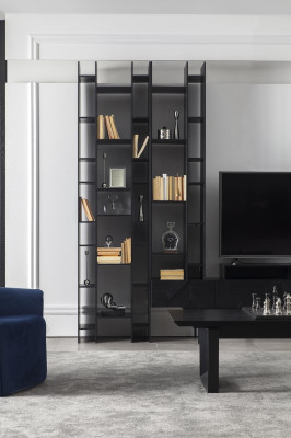 Black wall with open storage space for the living room