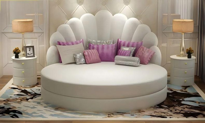 Elegant white round bed with velvety purple upholstery for modern bedroom
