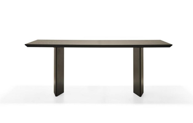 Elegant dining table made of warm bronze for modern homes