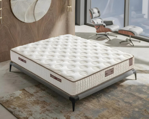 Elegant white bed with modern mattress