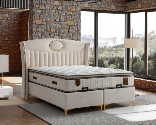 Elegant bed with pillow in light beige fabric and wood