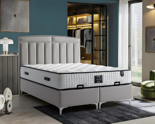 Modern gray bed made of fabric and wood with mattress