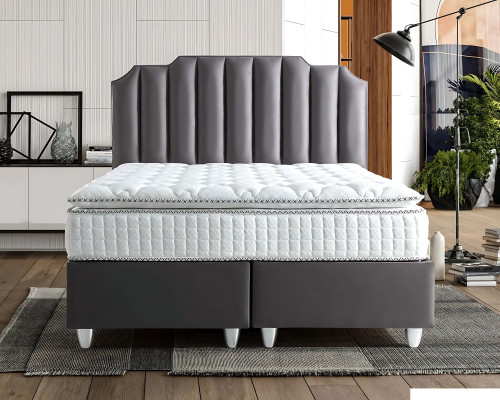 Elegant gray bed made of fabric and wood with mattress