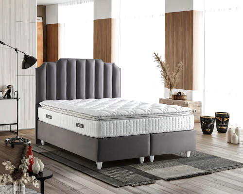 Elegant gray bed made of fabric and wood with mattress