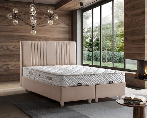 Elegant bed with pillow in light beige fabric and wood