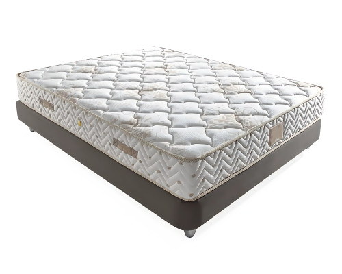 Elegant bed with pillow in light beige fabric and wood