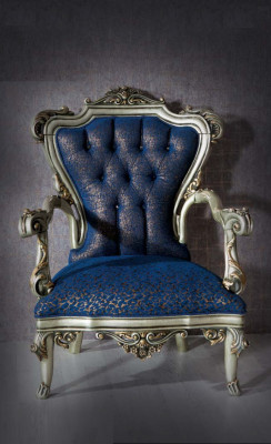 A fabulous armchair in classic style in blue with decorative patterns