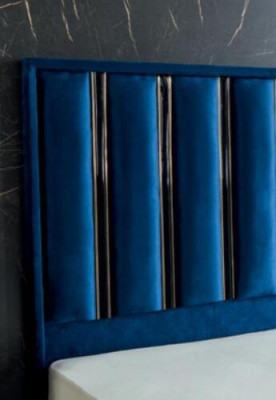 Sapphire blue designer bed with nightstands on gilded steel legs.