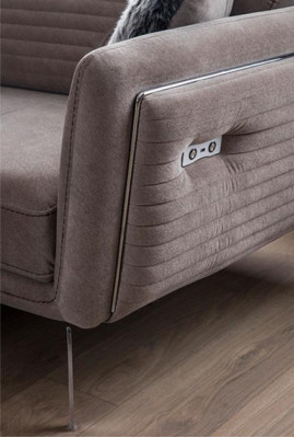 Luxurious, fashionable two-seater sofa with fabric upholstery on high legs