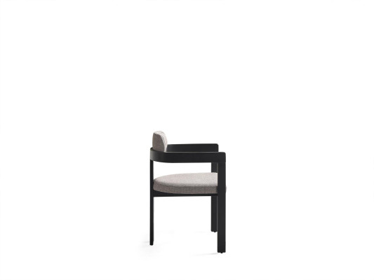 A state-of-the-art chair with an unusual shape and interesting legs with a comfortable gray-black backrest for the dining room.
