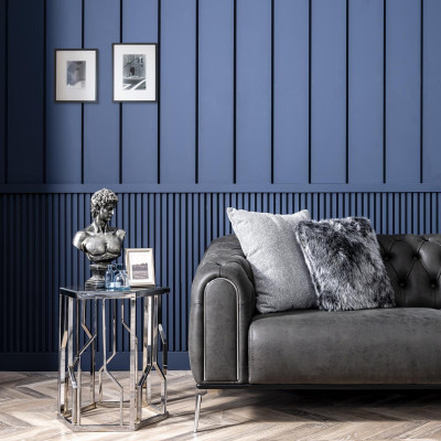 Black straight four-seater sofa in Chesterfield style for the living room.