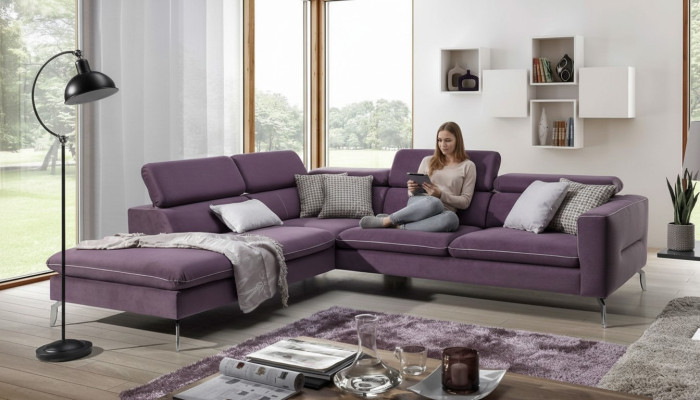 A functional, stylish corner sofa in a modern style for your home in purple luxury upholstery.