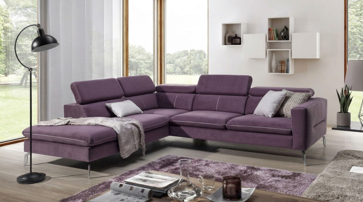 A functional, stylish corner sofa in a modern style for your home in purple luxury upholstery.