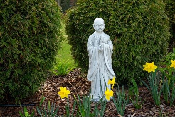 Buddha sculpture in stone look. Large decorative sculpture for garden figure.