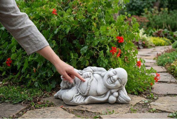 Figure Buddha sculpture in stone look. Large sculpture for garden decorative.