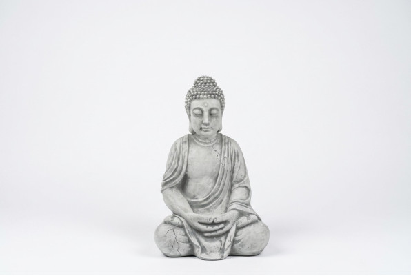 Buddha statue figure in stone look. Large sculpture for decorative garden.