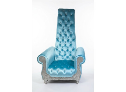 A refined armchair with a high backrest and a design reminiscent of a Voltaire chair.