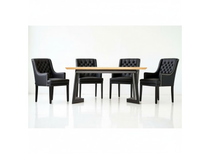 Designer dining table with 4 Chesterfield chairs seating group.