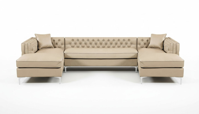 Beige sectional sofa living area couch corner suite upholstery Chesterfield furniture design.