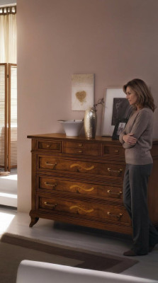 Wooden dresser in a classic style on elegant legs for living room or bedroom