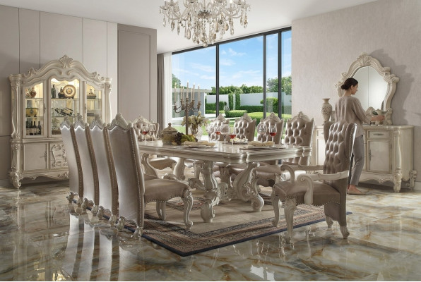 Classic dining room set in antique white. Large dining table with Chesterfield chairs.
