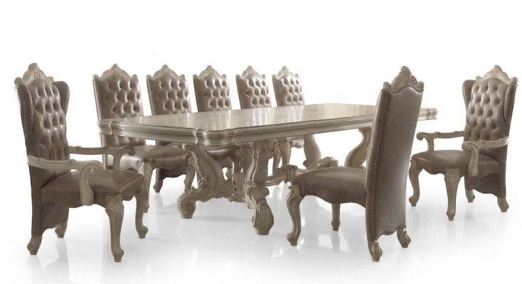 Classic dining room set in antique white. Large dining table with Chesterfield chairs.