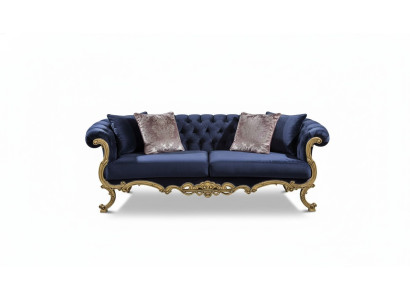 Chesterfield three-seater sofa in luxurious blue color for the living room