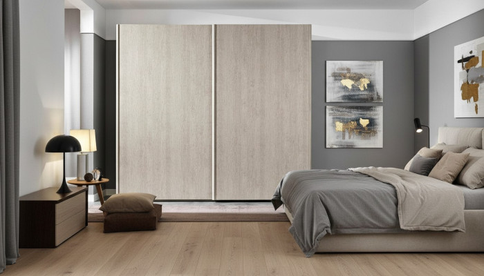 Modern wardrobe with sliding doors for the bedroom made of natural wood