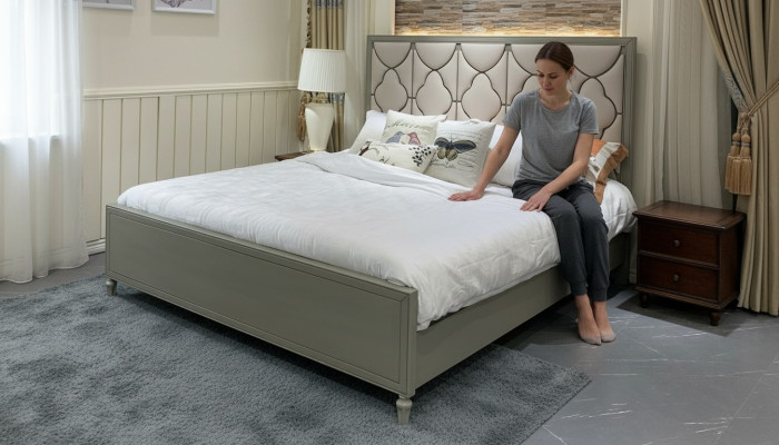Premium double bed in classic design with beige leather upholstery