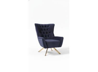 Luxurious blue Chesterfield armchair with velvet upholstery for the living room