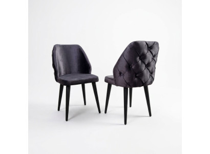 Padded gray wood chair, Chesterfield style, on black legs for dining room.