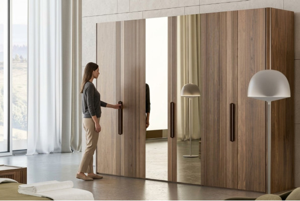 Large brown wardrobe bedroom closet with mirror cabinets