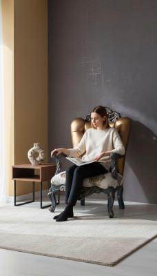Chesterfield design armchair with a golden backrest for the living room