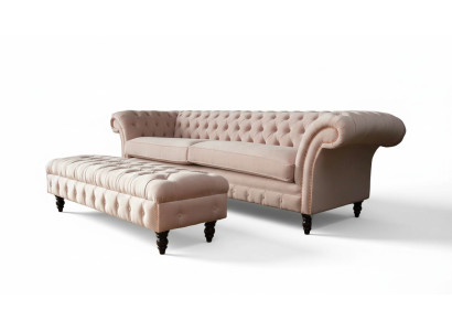 A luxurious pink four-seater sofa in Chesterfield design, including seat cushions