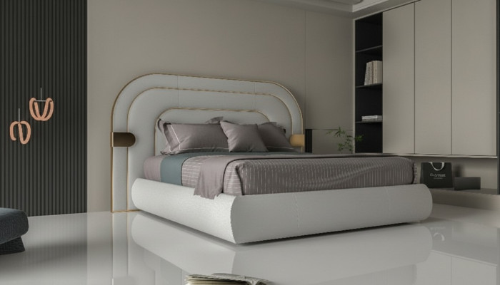 Luxury gray bed with gold details in modern design and upholstered headboard