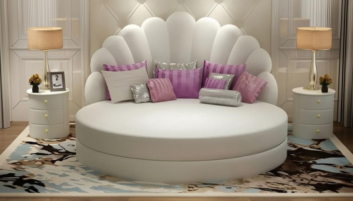Elegant white round bed with velvety purple upholstery for modern bedroom