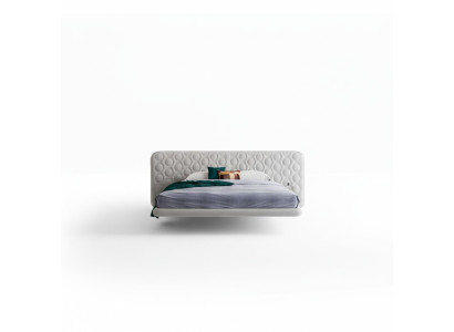 Modern white bed with minimalist and rounded design