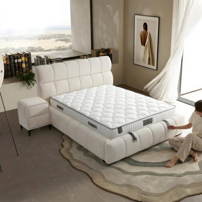 Elegant blue bed made of fabric and wood with mattress